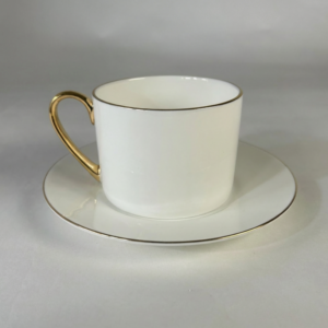 white ceramic coffee cup and saucer